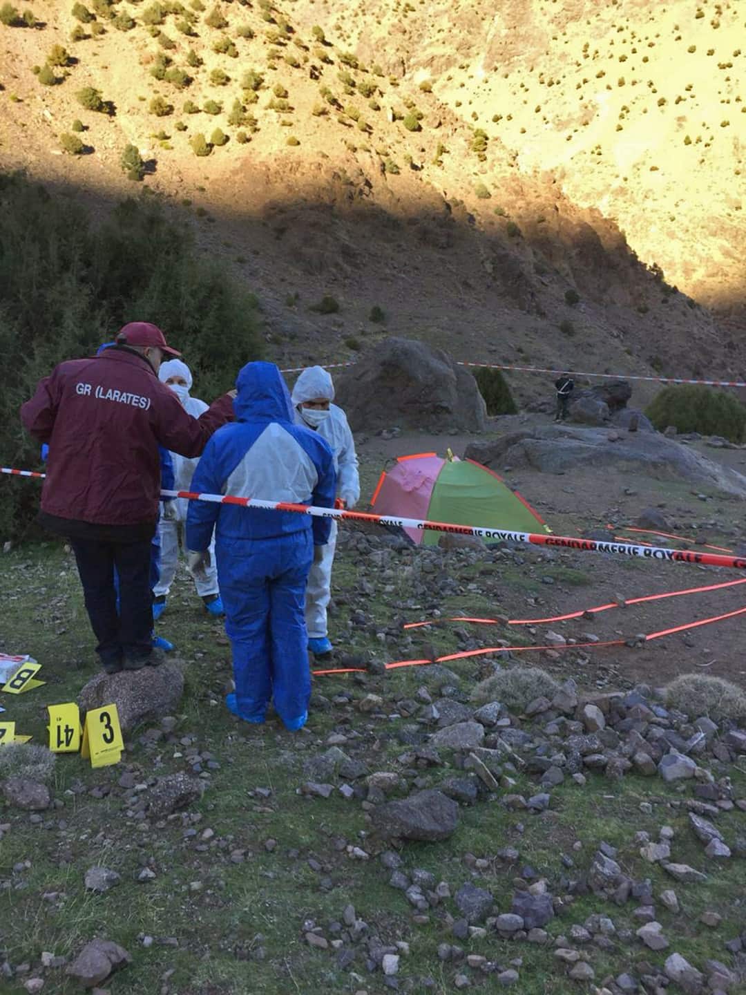 Police at the scene of a crime where the bodies of two Scandinavian women were found in an isolated mountainous area.