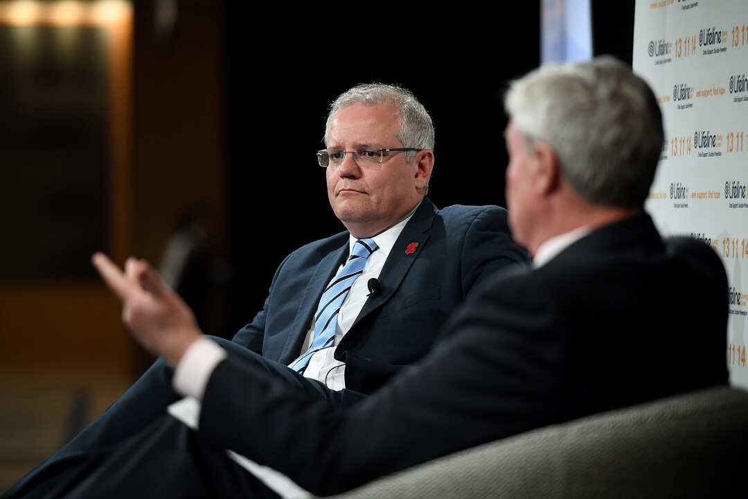 Prime Minister Scott Morrison looks on as Mike Munro hosts a Q&A at the Lifeline Australia Luncheon in Sydney, Friday, November 9, 2018. (AAP Image/Joel Carrett) NO ARCHIVING
