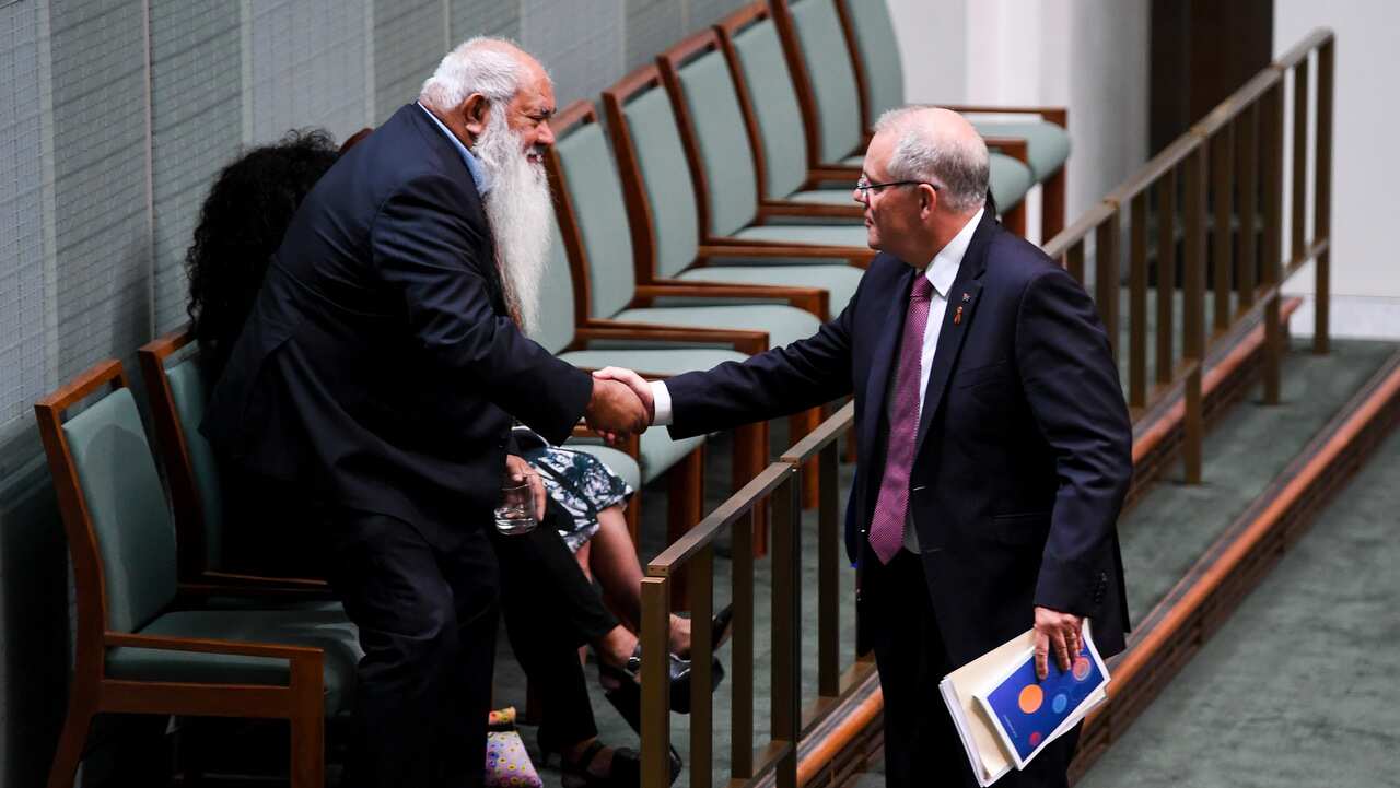 Australian Prime Minister Scott Morrison (right) shakes hands with Labor Senator Pat Dodson as he arrives to deliver the Closing the Gap report.