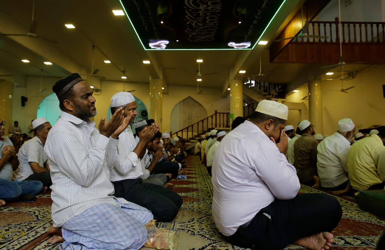 Sri Lankan muslims attend the main Friday prayers in a Mosque in Colombo.