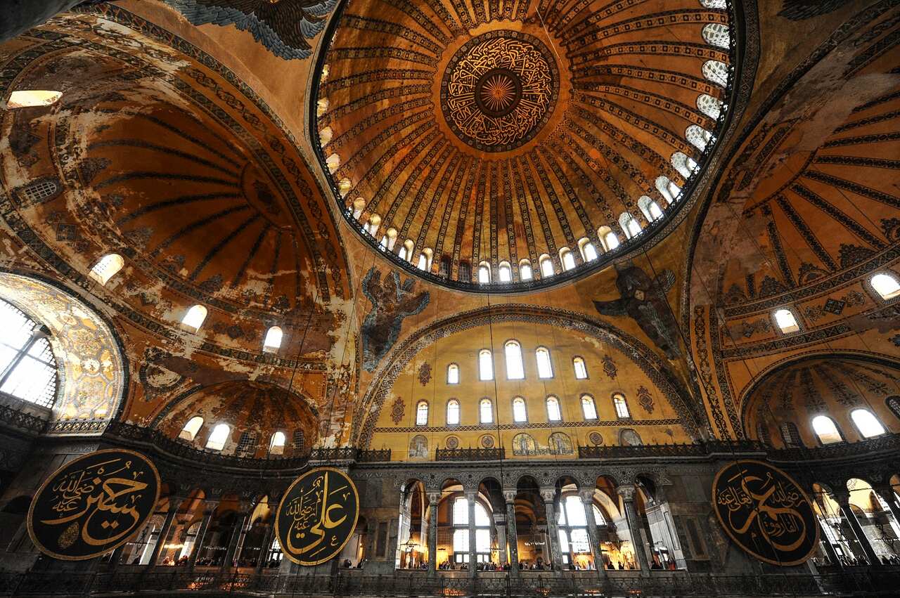 Visitors walk inside the Byzantine-era Hagia Sophia, in the historic Sultanahmet district of Istanbul, October 15, 2010.  