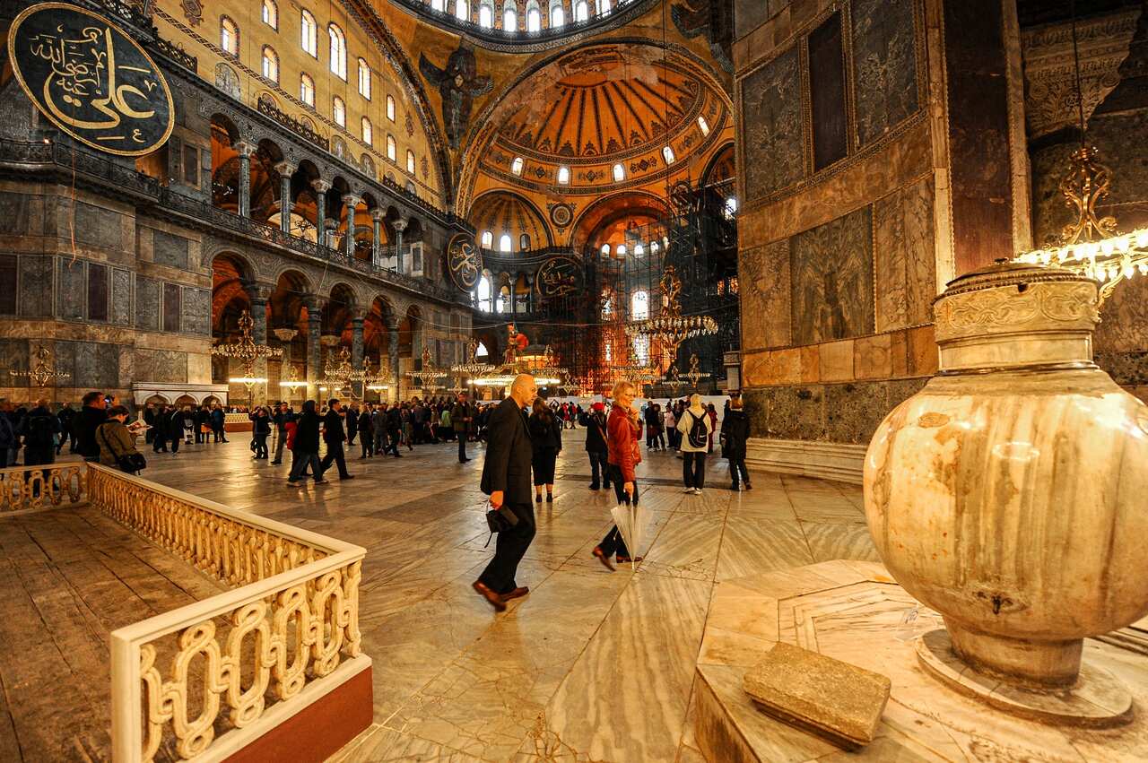 Visitors walk inside the Byzantine-era Hagia Sophia, in the historic Sultanahmet district of Istanbul, October 15, 2010.  