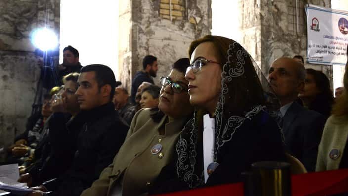 Iraqi Christians take part in a Christmas mass at the Saint Paul's church in Mosul city.