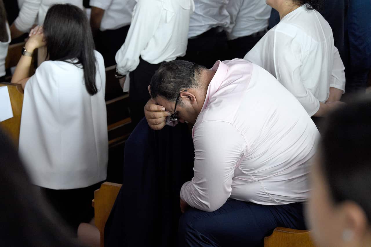 Mourners during the funeral for Anthony Abdallah, 13, Angelina Abdallah, 12, and Sienna Abdallah, 8, at Our Lady of Lebanon Co-Cathedral in Sydney.