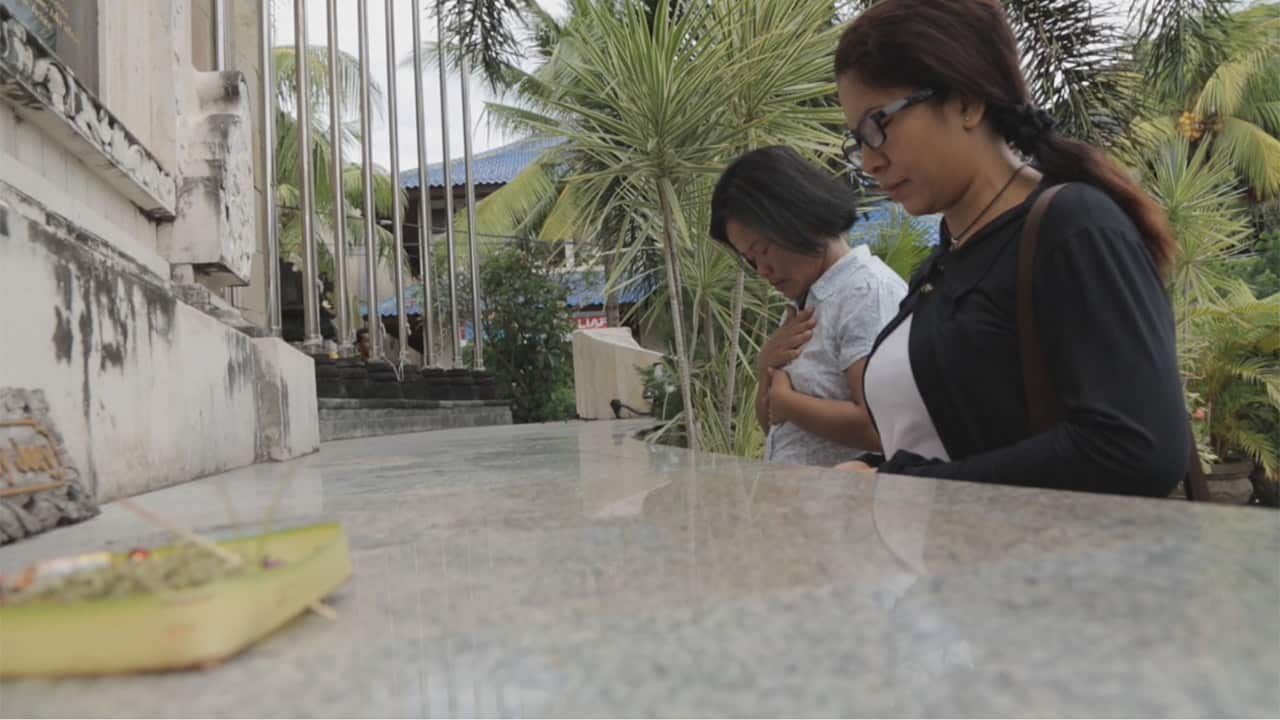 Nyoman (left) and fellow widow Ni Luh Erniati at the Bali bombing memorial in Kuta.