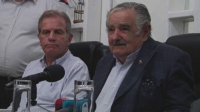 José Mujica (right) in a more presidential setting at one of his official engagements.
