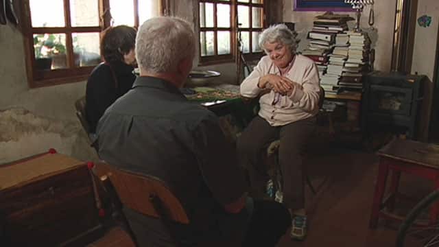 Mujica's wife, Senator Lucia Topolansky, speaks to David O'Shea at the small farmhouse in Montevideo.