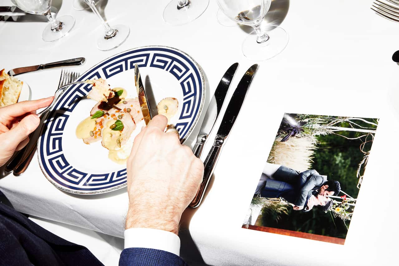 A photo of Brian Schaefer and Stephen Mack during dinner at a gathering celebrating their recent wedding in New York.