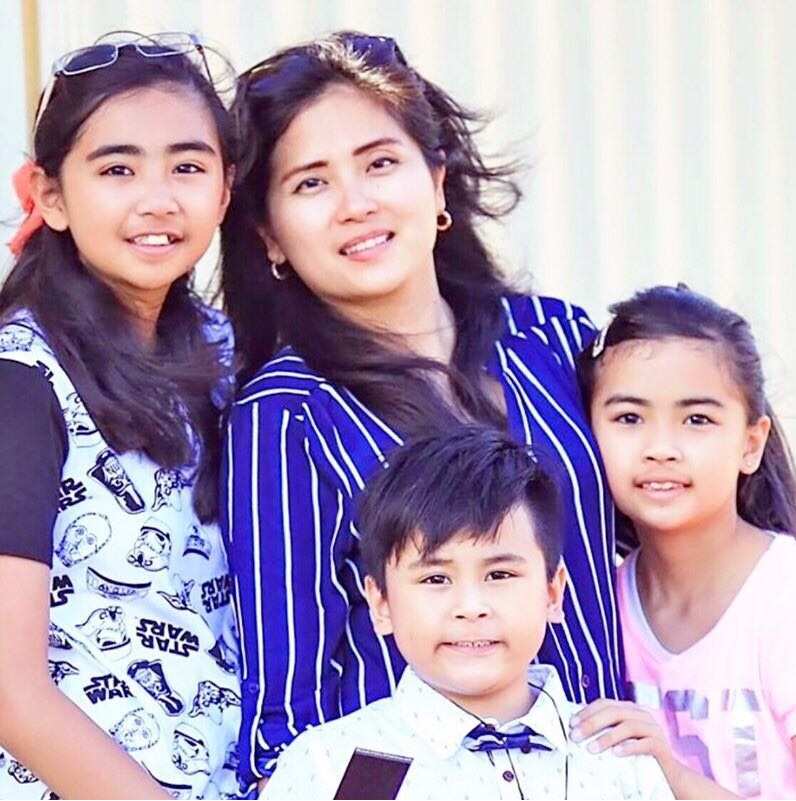Bernadette Romulo with her children.