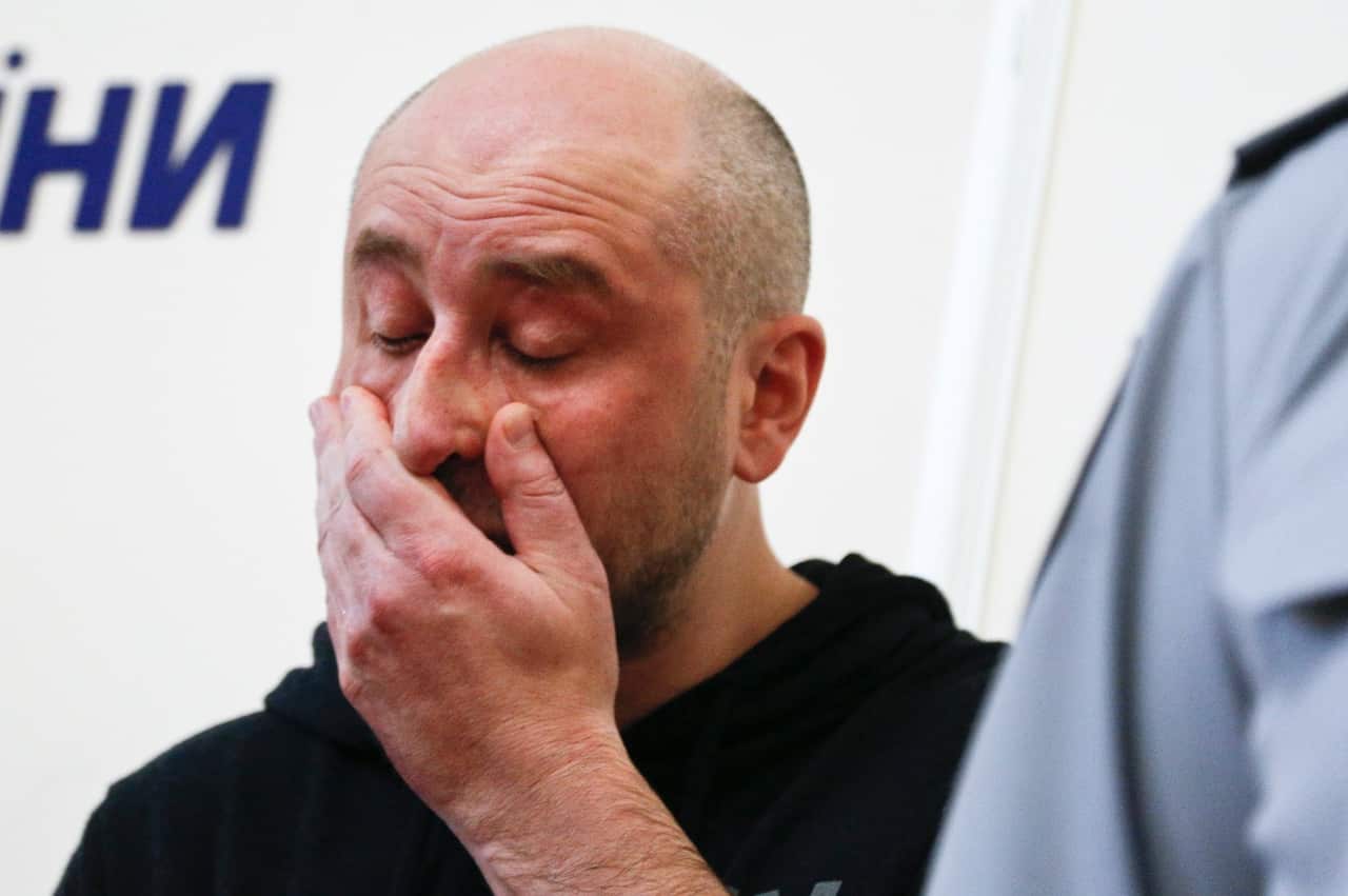 Russian journalist Arkady Babchenko, reacts during a news conference with Vasily Gritsak