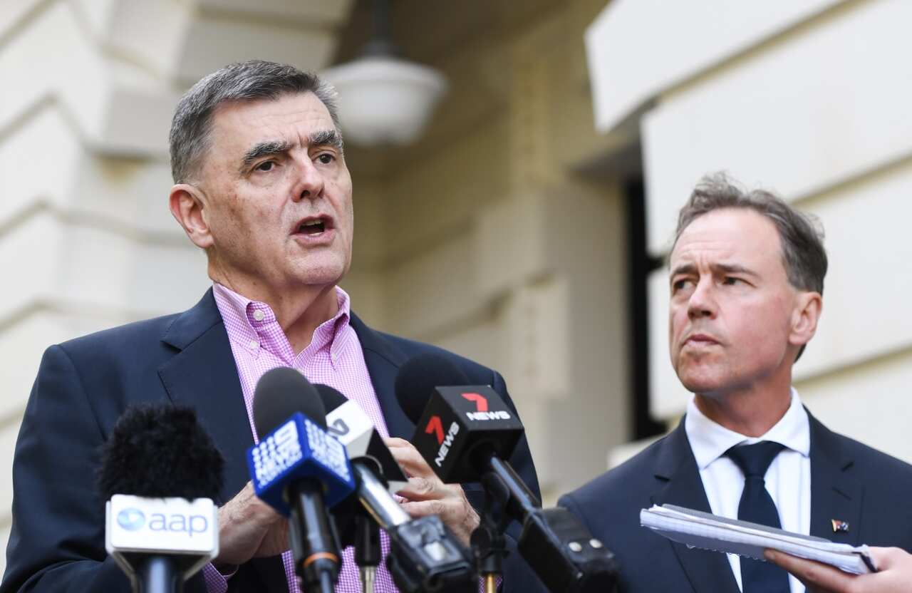 Chief Medical Officer Brendan Murphy (left) speaks to the media while Federal Minister for Health Greg Hunt looks on