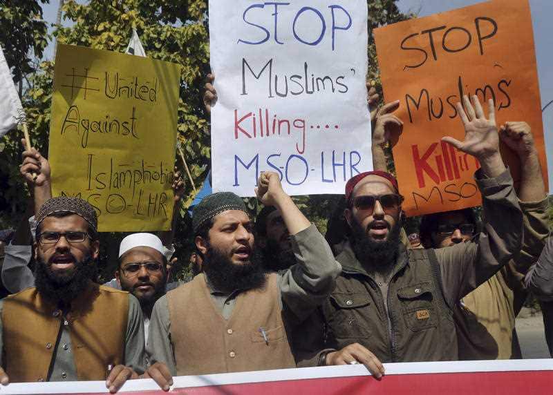 Members of Muslim Students Organisation shout slogans during a demonstration to condemn the New Zealand mosque shooting, in Lahore, Pakistan.