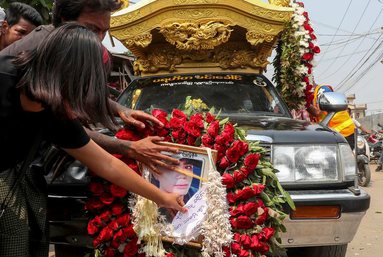 A hearse carrying the body of Saw Pyae Naing is driven in Mandalay, Myanmar.