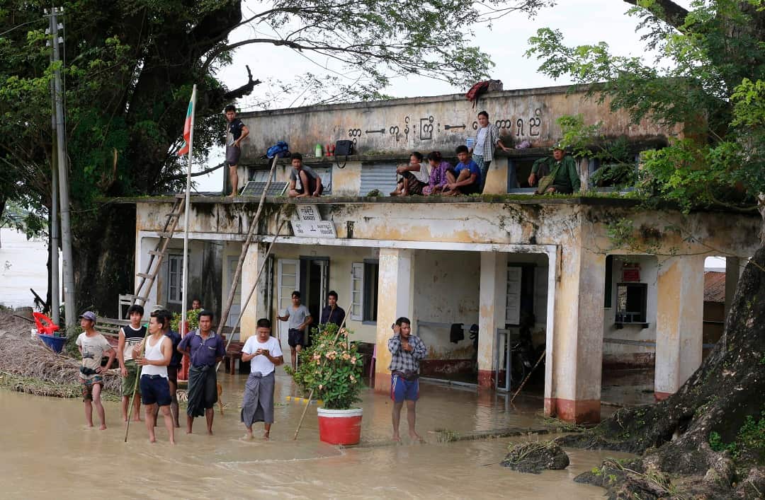 Residents wait for rescuers at Kongyi Railway station near Naypyitaw.