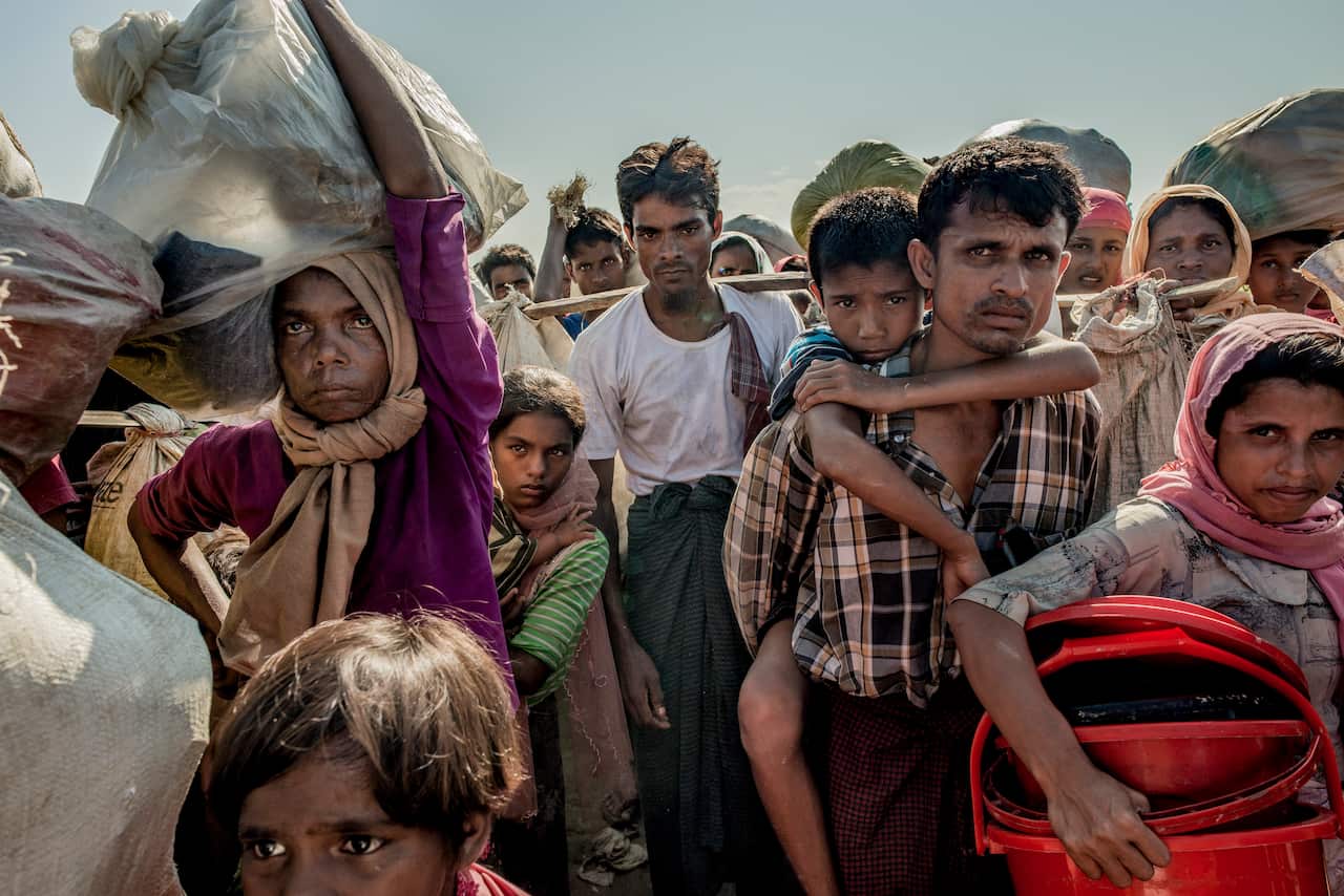 Rohingya refugees from Myanmar wait for permission to proceed to the refugee camps, in Cox's Bazar, Bangladesh.