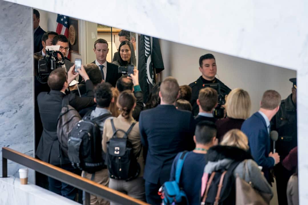Facebook CEO Mark Zuckerberg and his wife Priscilla Chan, top center left, leave a meeting with Senator Bill Nelson.