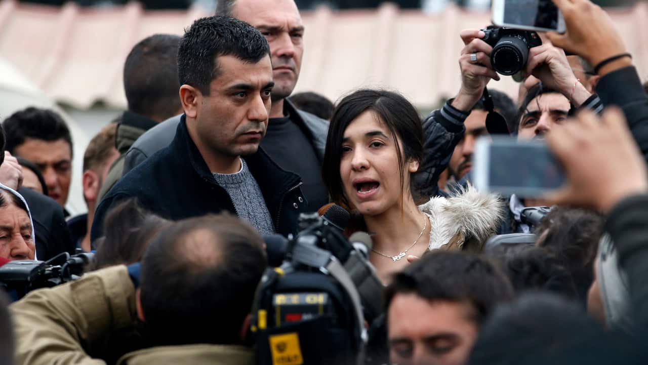 Nadia Murad speaks during her visit to the makeshift refugee camp at the northern Greek border point of Idomeni in 2016.