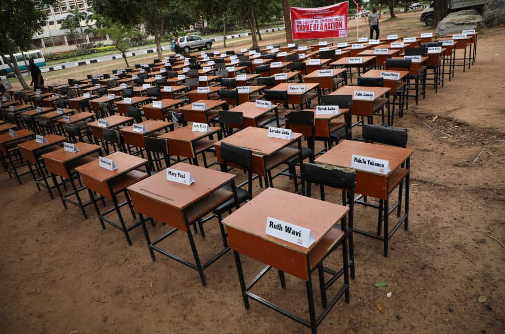 Names of the remaining Chibok schoolgirls are displayed with their desk on April 14, 2019 (Getty Images)