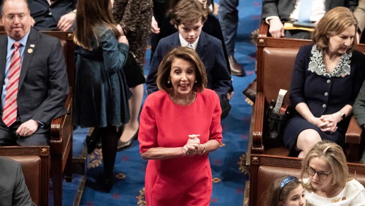 Nancy Pelosi oenters the chamber as the House of Representatives assembles for the first day of the 116th Congress.