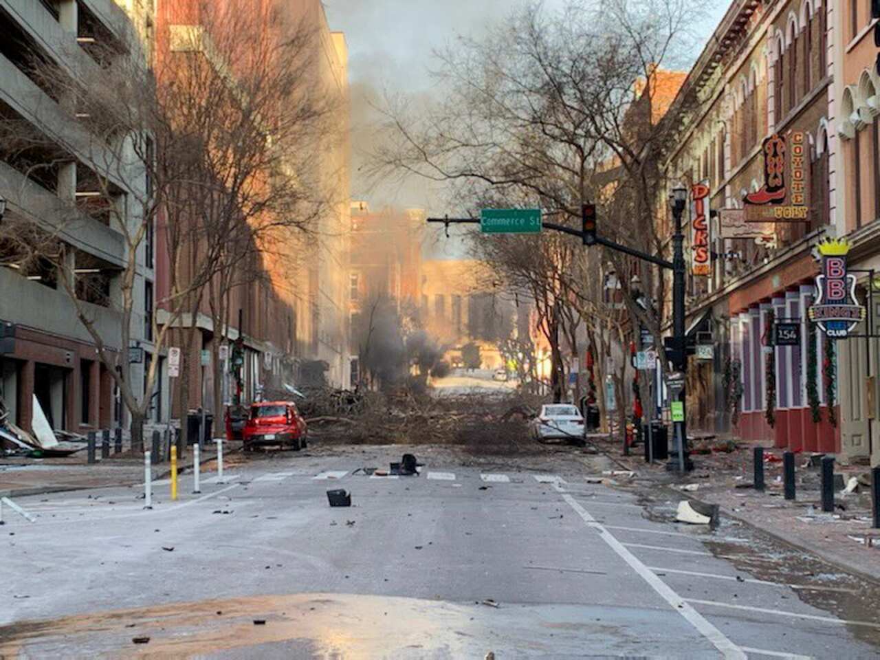 Authorities were alerted to a suspicious vehicle which soon exploded injuring three people and damaging buildings and vehicles nearby.