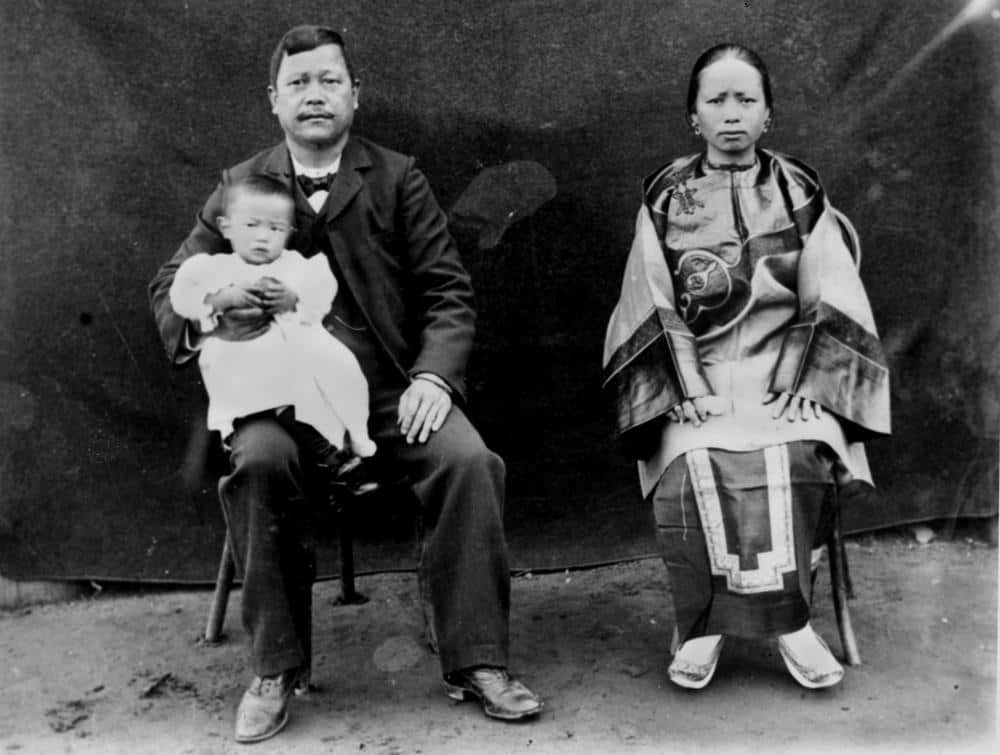 Family portrait of storekeeper Al Coy, his wife and baby at St. George, Queensland. They were part of the migrants from the Guangzhou province who arrived in north Queensland in the wake of the Palmer River gold rush of the 1870s.