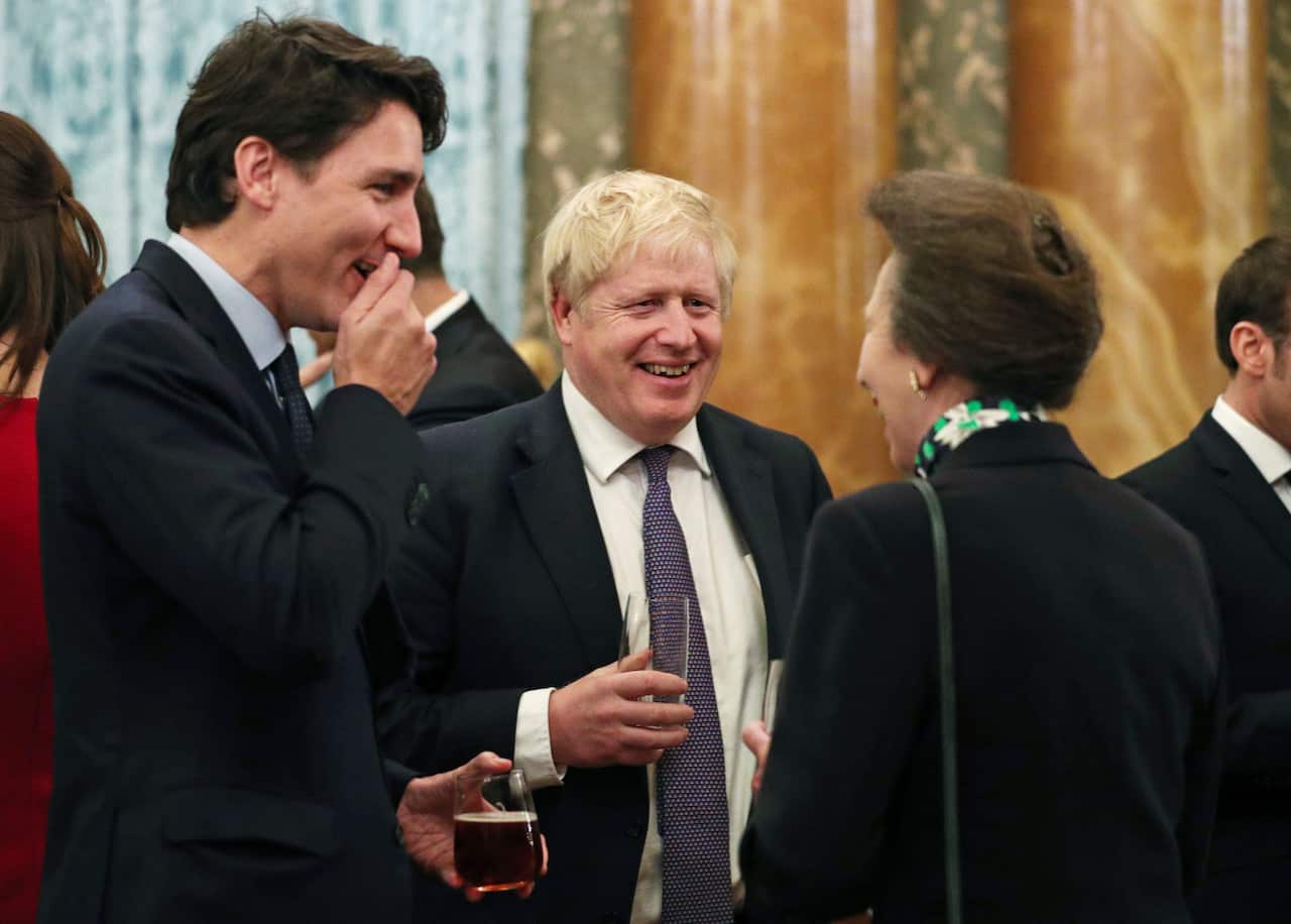 The Princess Royal, Anne, talks to Canadian Prime Minister Justin Trudeau and Prime Minister Boris Johnson.