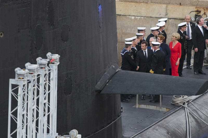 French President Emmanuel Macron, former Australian Prime Minister Malcolm Turnbull and Foreign Minister Julie Bishop on the deck of HMAS Waller.