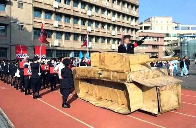 Students, whose faces have been digitally obscured, wearing Nazi uniforms during a Cosplay event at the school in Hsinchu, western Taiwan (AAP)