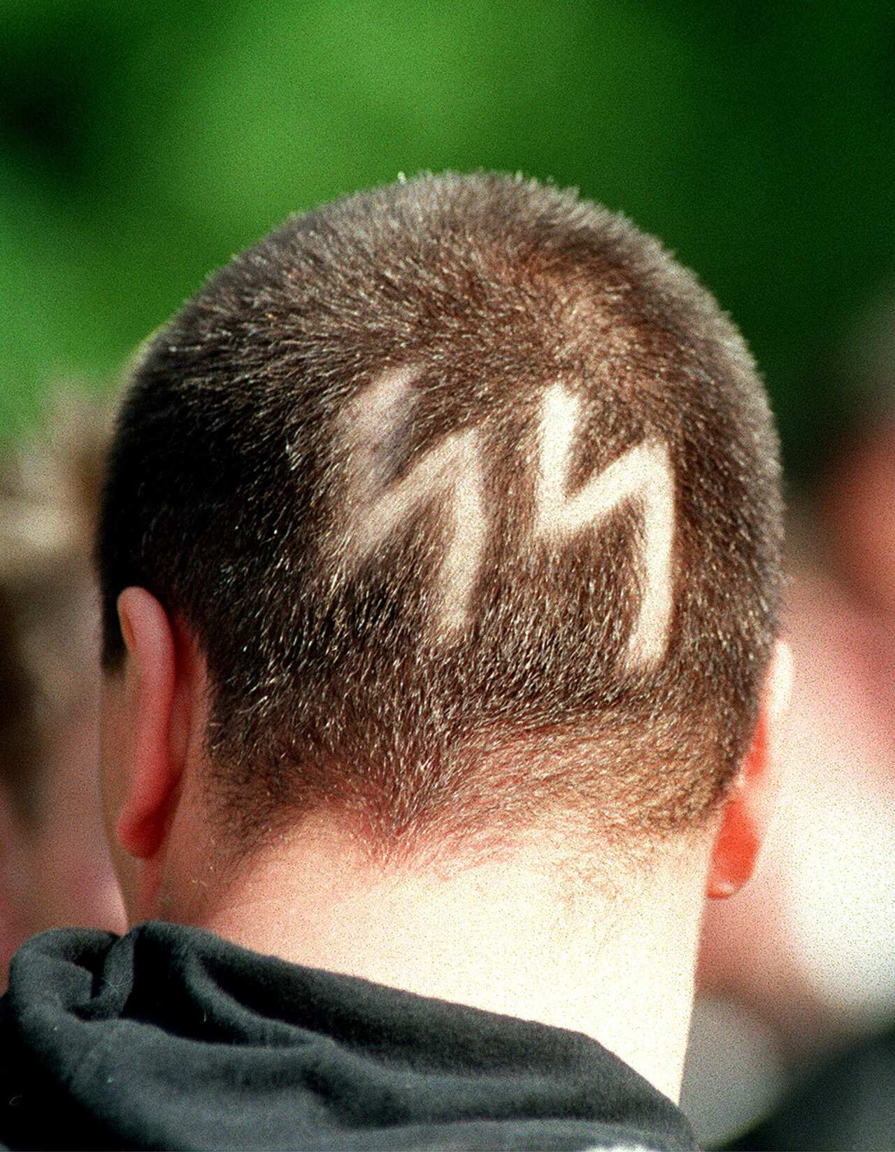 Dresden has struggled with its association with the far-right. A neo-Nazi with SS runes shaved into his head, attends the Dresden funeral of a Neo-Nazi leader.