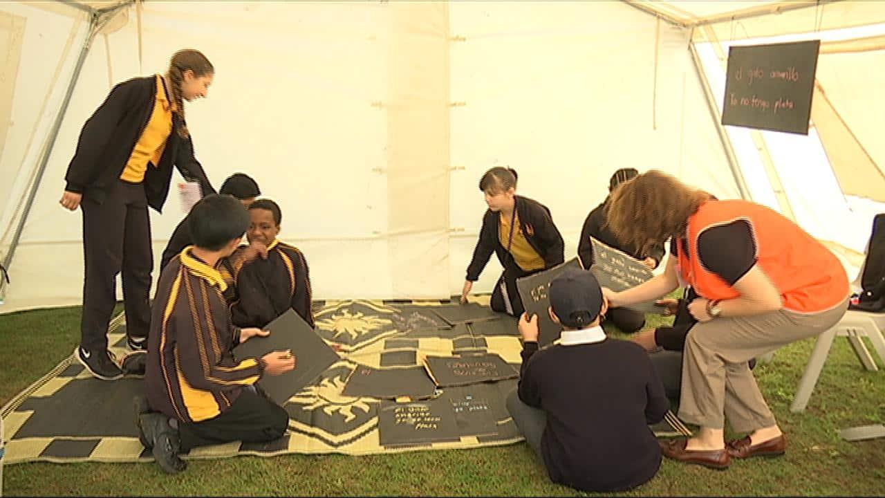 Students go to Spanish class. They must learn the language of the place they've sought refugee (SBS)