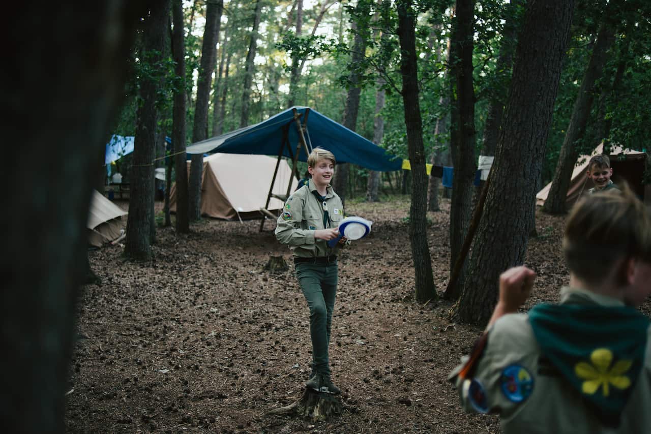 Danil Bos, a scout, at the group's camp before participating in a Dutch tradition known as "dropping".
