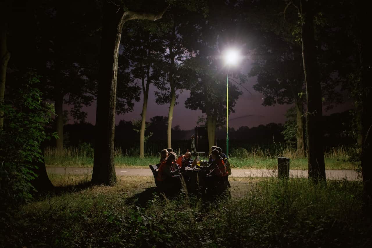 A group of children participate in a Dutch tradition known as "dropping," where groups of children are deposited in a forest and have to find their way back to base, near Eindhoven, Netherlands. (Dmitry Kostyukov/The New York Times)