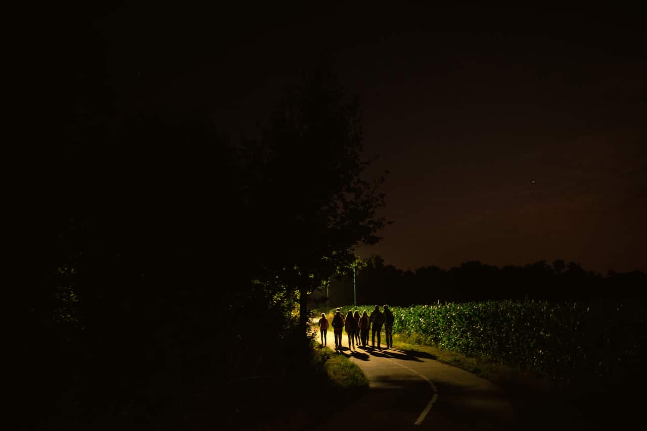 A group of children participate in a Dutch tradition known as "dropping," where groups of children are deposited in a forest and have to find their way back to base, near Eindhoven, Netherlands. (Dmitry Kostyukov/The New York Times)
