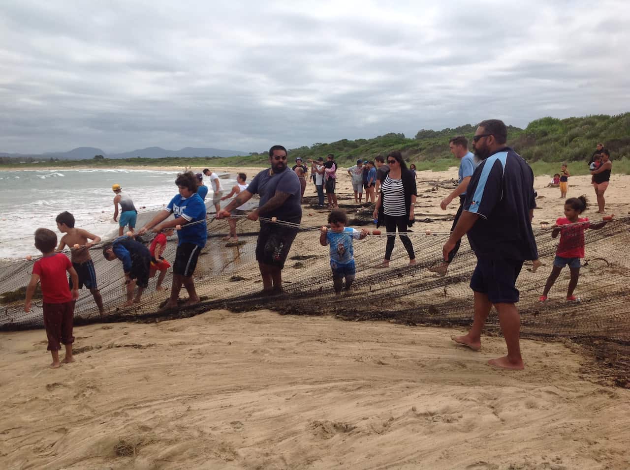 Indigenous families practicing cultural fishing. 