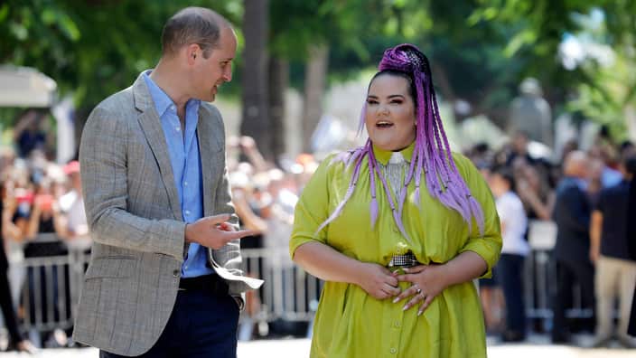 Britain's Prince William speaks with Israeli 2018 Eurovision song contest winner Netta Barzilai during a tour of Rothschild Boulevard, in Tel Aviv.