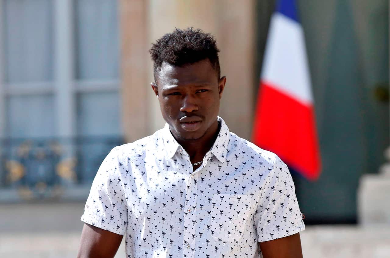 Mamoudou Gassama leaves the presidential Elysee Palace after meeting with the French President in Paris.