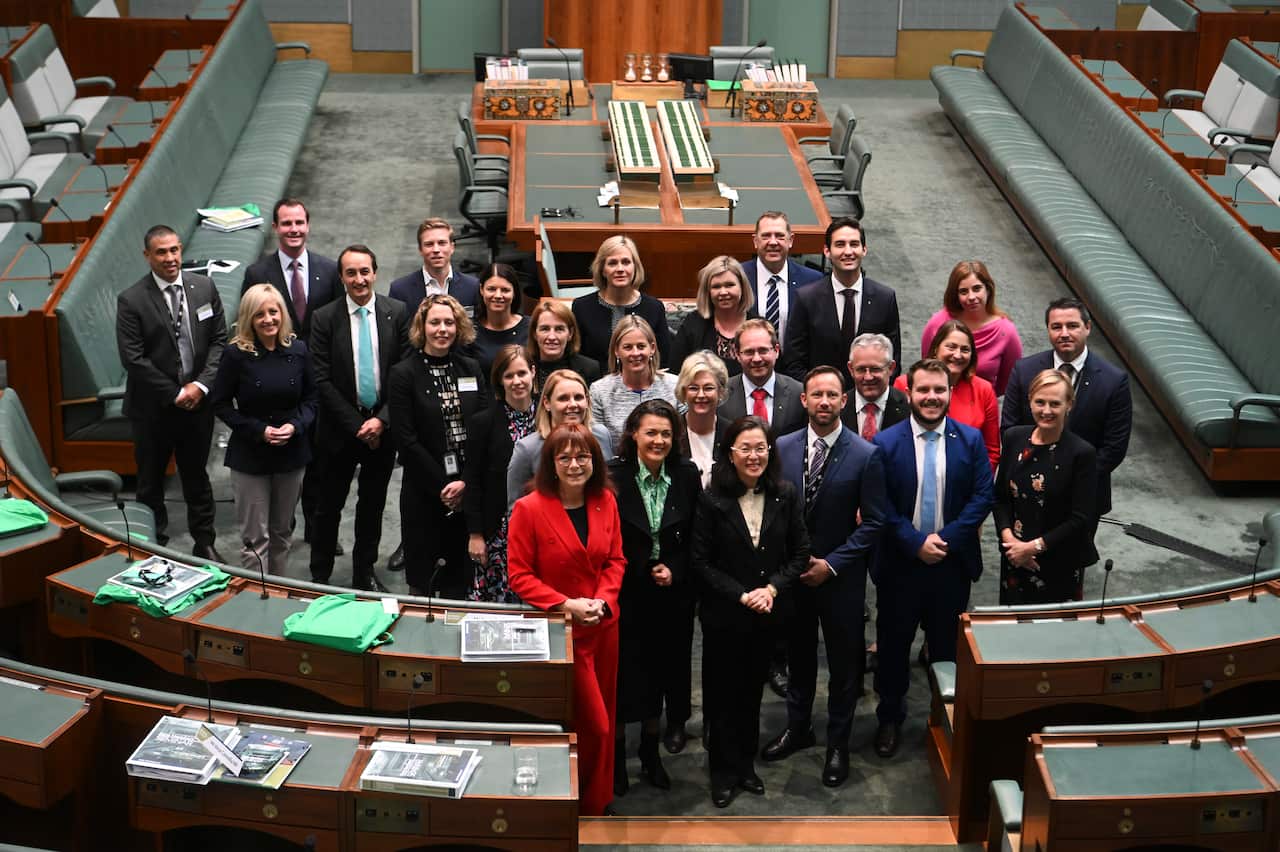 Newly elected MPs pose for photographs during a new Members' Seminar in the House of Representatives at Parliament House in Canberra, Tuesday, June 25, 2019. (AAP Image/Lukas Coch) NO ARCHIVING