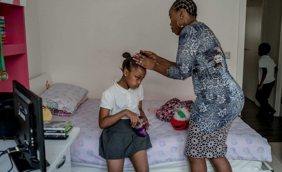 Tshego with her mother, Carol Lengolo, in their home in New Cross, in Southeast London. Ms. Lengolo, who grew up in South Africa, was raised to love the British royal family.