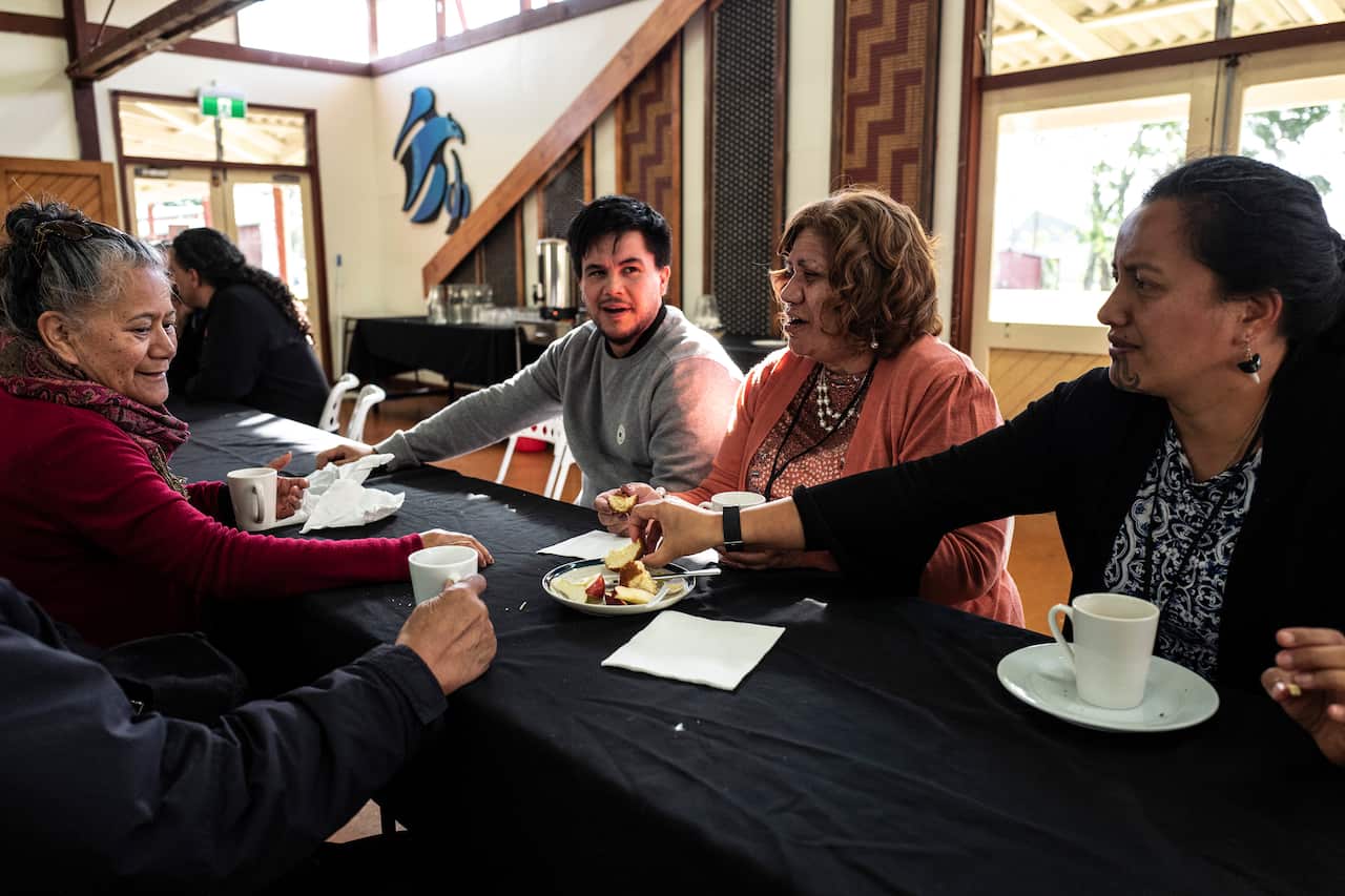 Sharing a meal at the Hoani Waititi communal hall in Auckland, New Zealand.