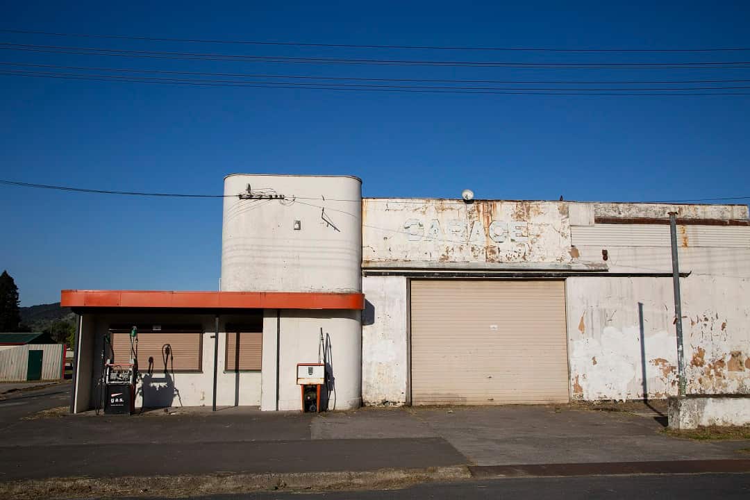 A shuttered gas station on Barry Avenue, the main street in Ruatoria, New Zealand.