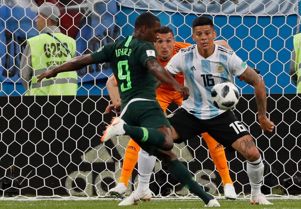 Odion Ighalo of Nigeria (L) in action during the FIFA World Cup 2018 group D preliminary round soccer match between Nigeria and Argentina