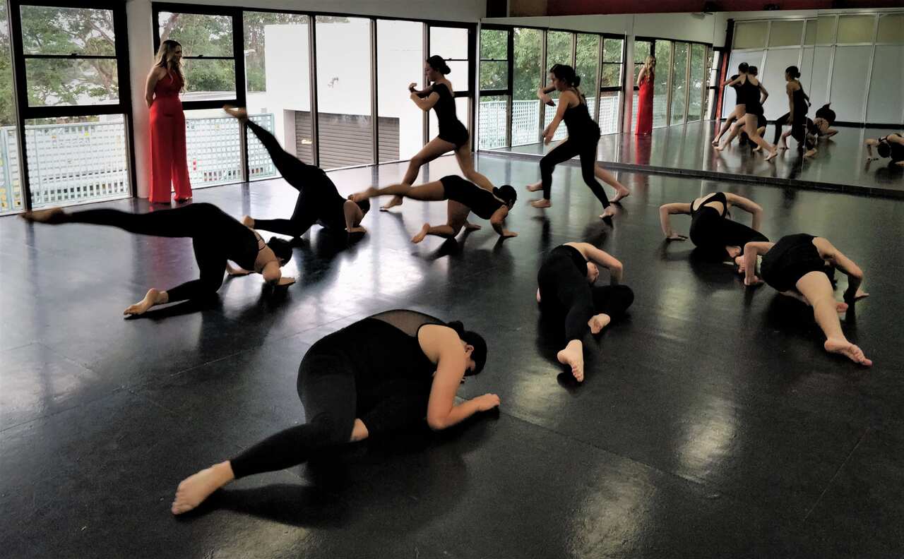Nikki Webster teaching a teenage dance class.