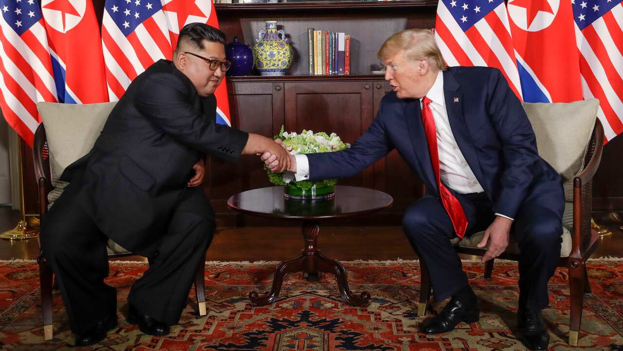 North Korea leader Kim Jong Un and US President Donald Trump shake hands during their first meeting in Singapore in June 2018. 