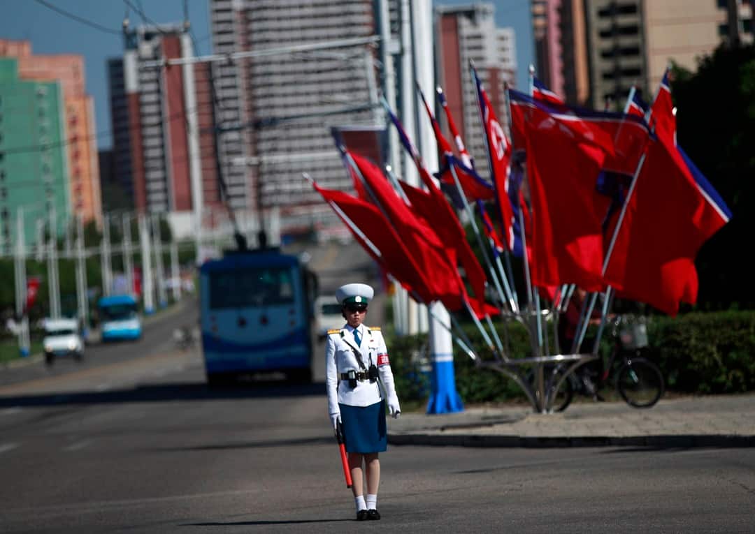 epa07006246 A North Korean traffic policewoman directs traffic in Pyongyang, North Korea, 08 September 2018. North Korea will celebrate its National Day and the 70th anniversary of its Founding on 09 September 2018.  EPA/HOW HWEE YOUNG