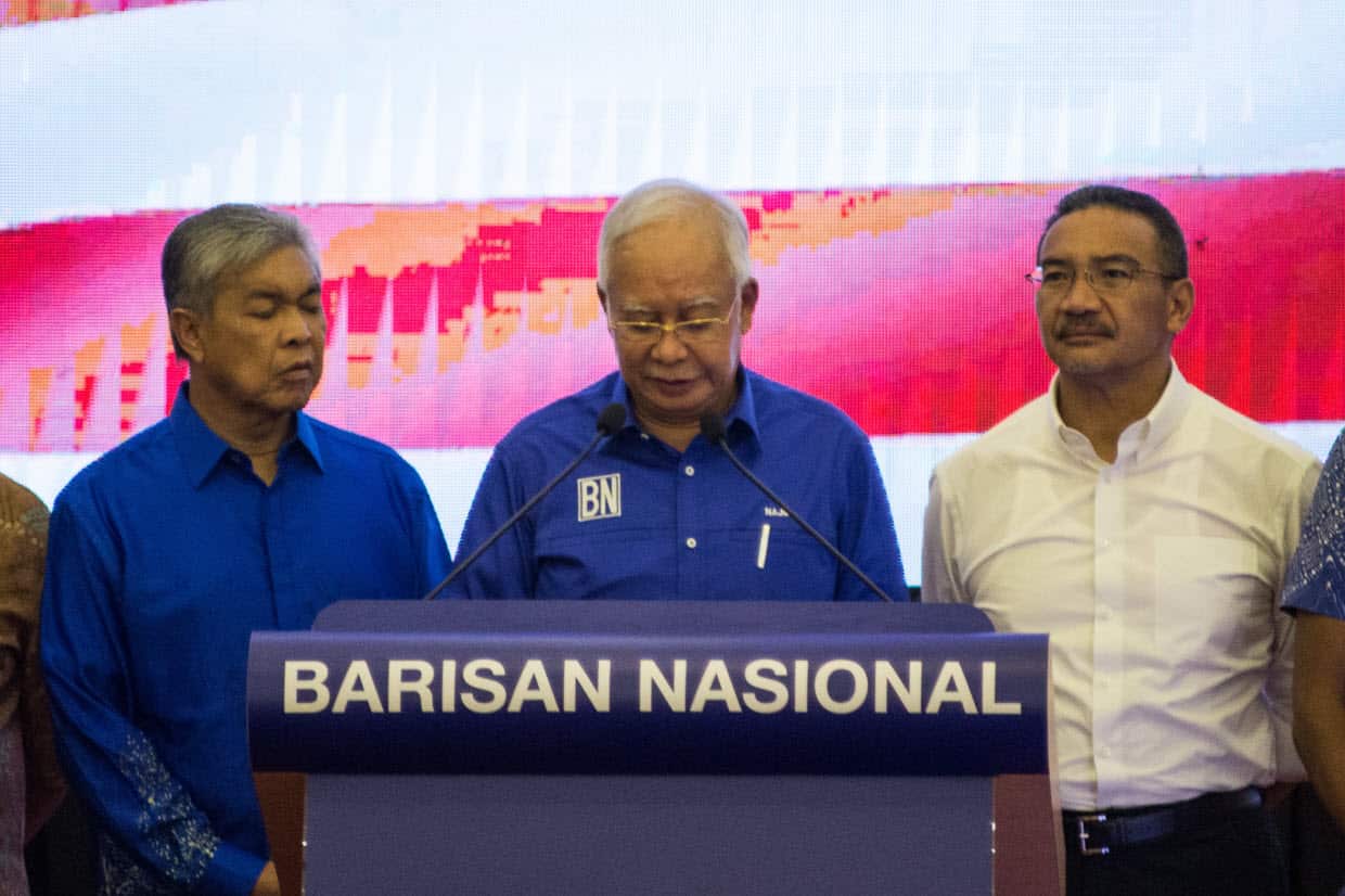 Outgoing Malaysian prime minister Najib Razak (C) of the Barisan National party speaks at a press conference