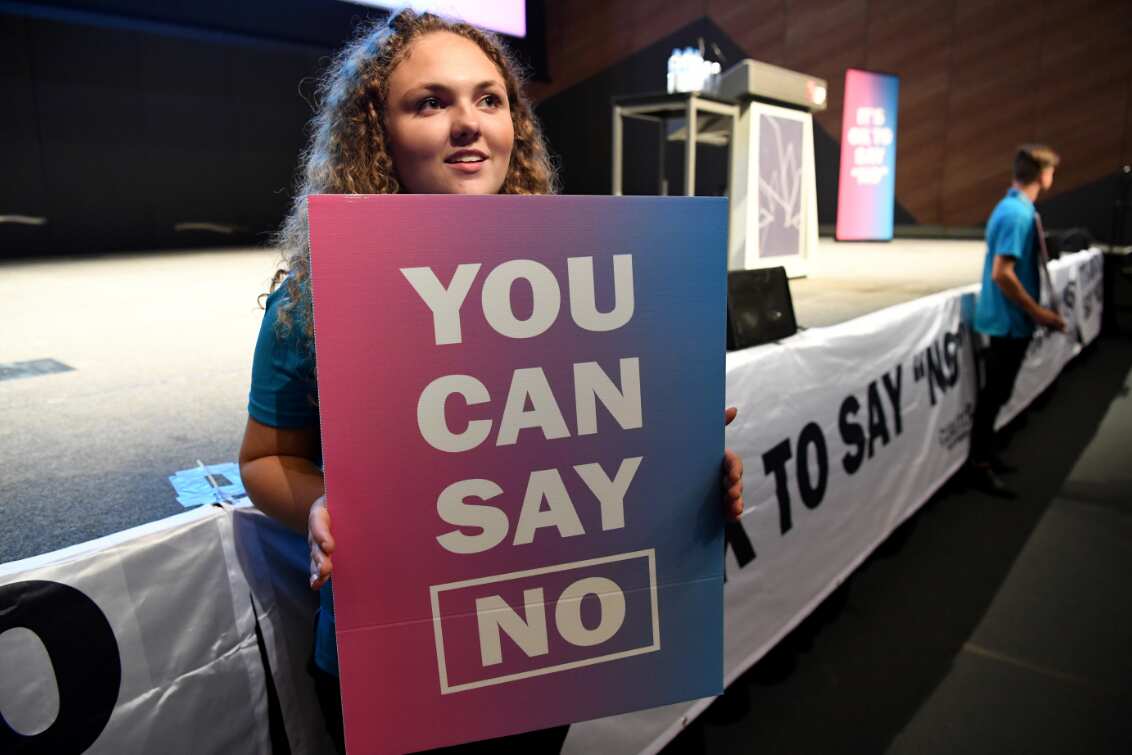 A "NO" supporter holds a banners at a Coalition for Marriage campaign launch in Melbourne.