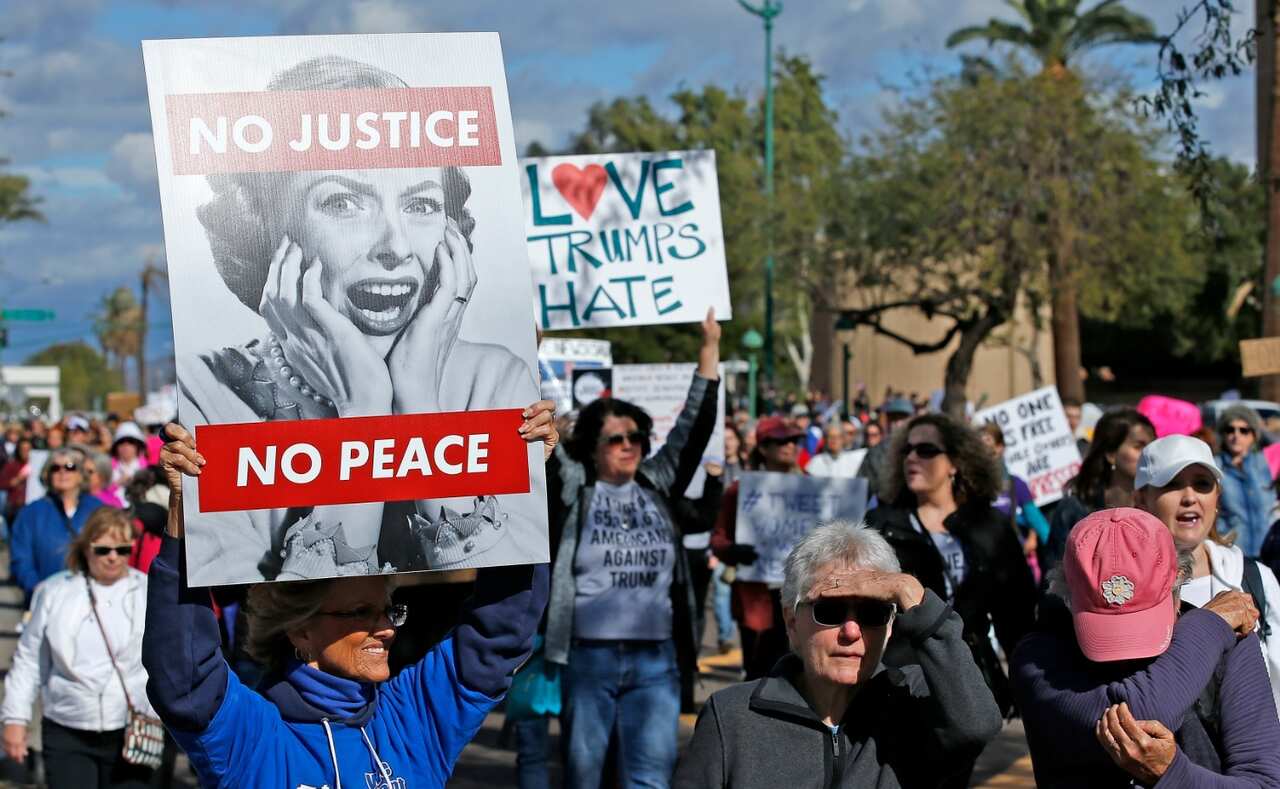 Demonstrators march in support of the Women's March in Washington, Saturday, Jan. 21, 2017, in Phoenix (AAP)