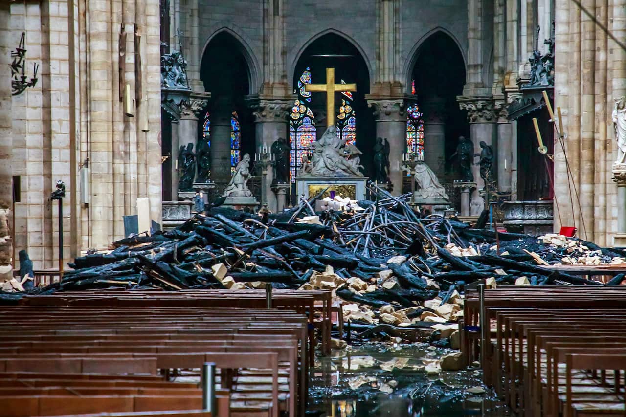 The damaged interior of the Cathedral of Notre Dame in Paris on April 16, 2019, the day after a fire ravaged the medieval structure. (Christophe Petit Tesson/Pool via The New York Times) 