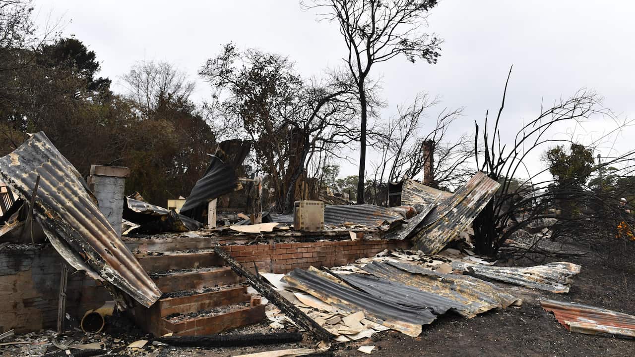 The burnt out remains of a house is seen from a bushfire in the Southern Highlands town of Wingello.