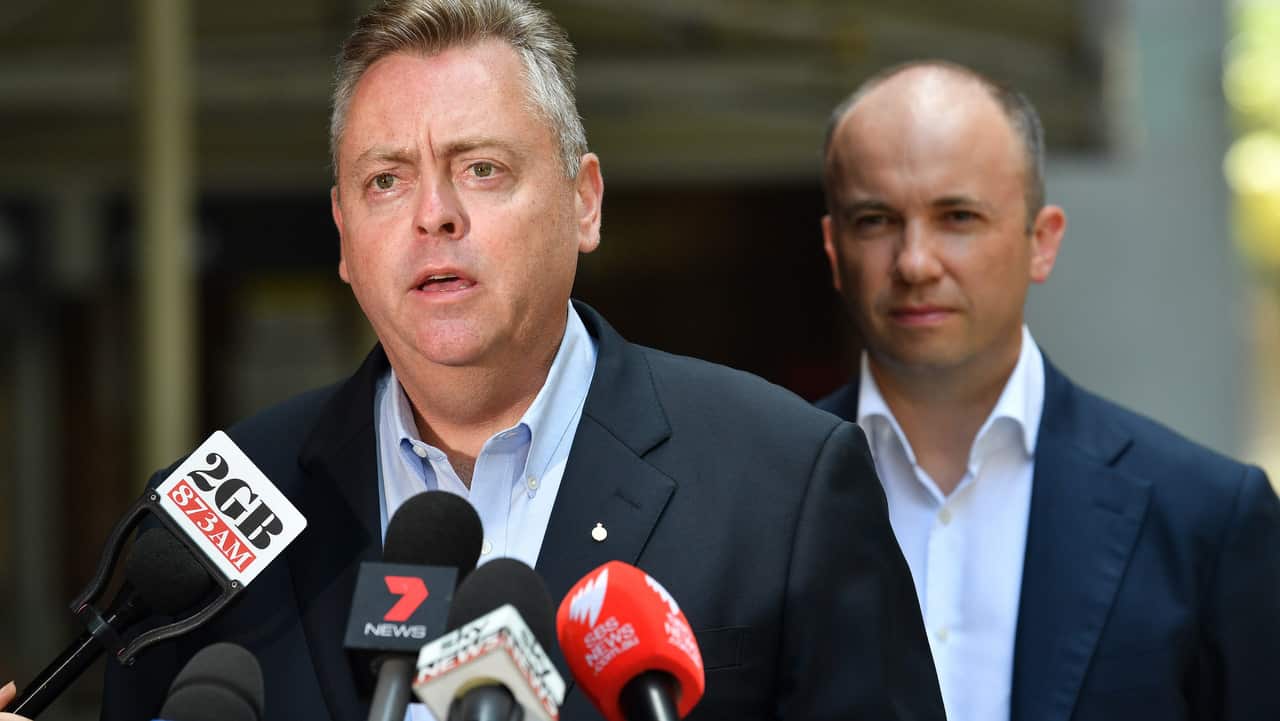 Minister for Planning and Housing Anthony Roberts speaks to the media alongside Minister for Better Regulation Matt Kean during a press conference.